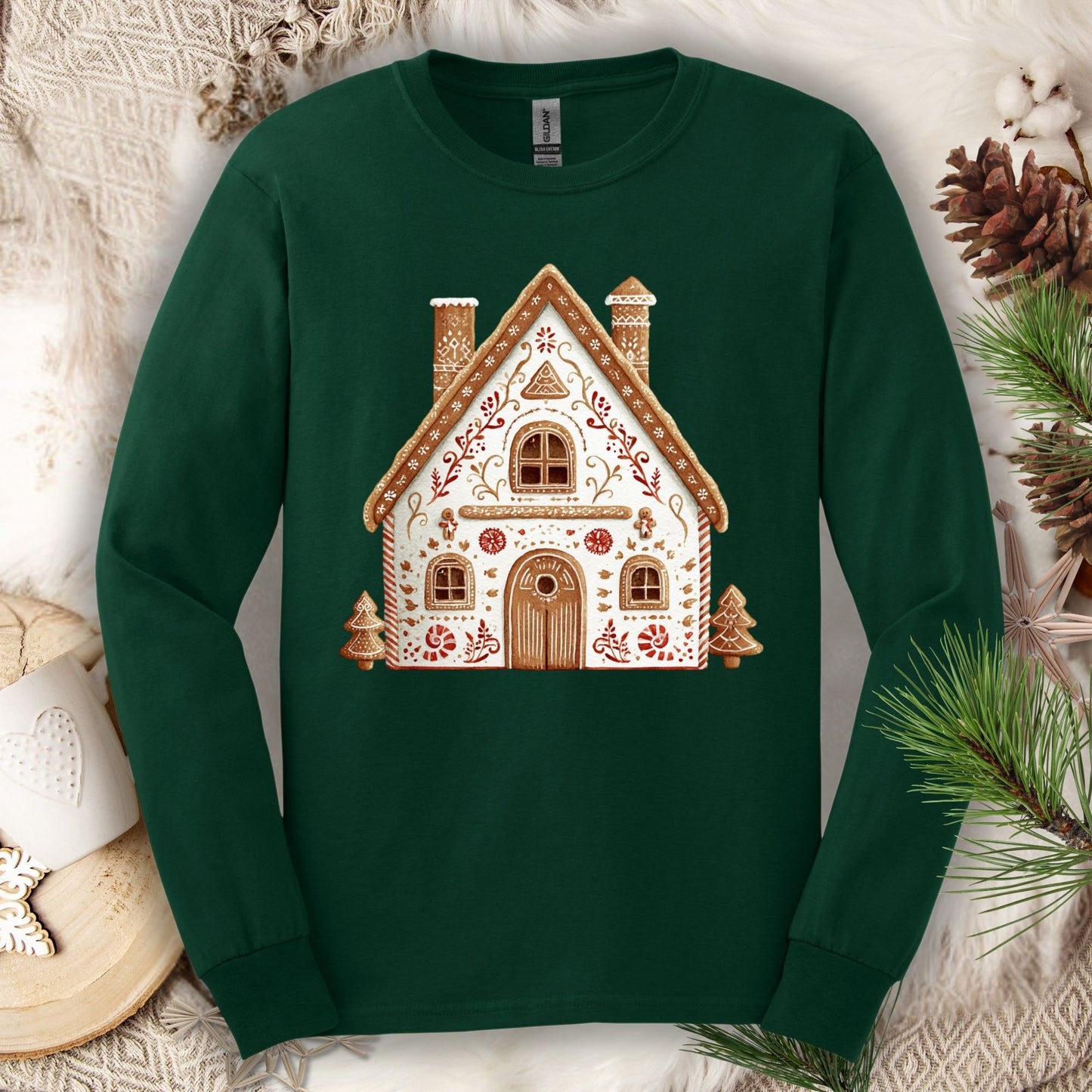 Forest Green Gildan long sleeve tee with a folk art gingerbread house design.