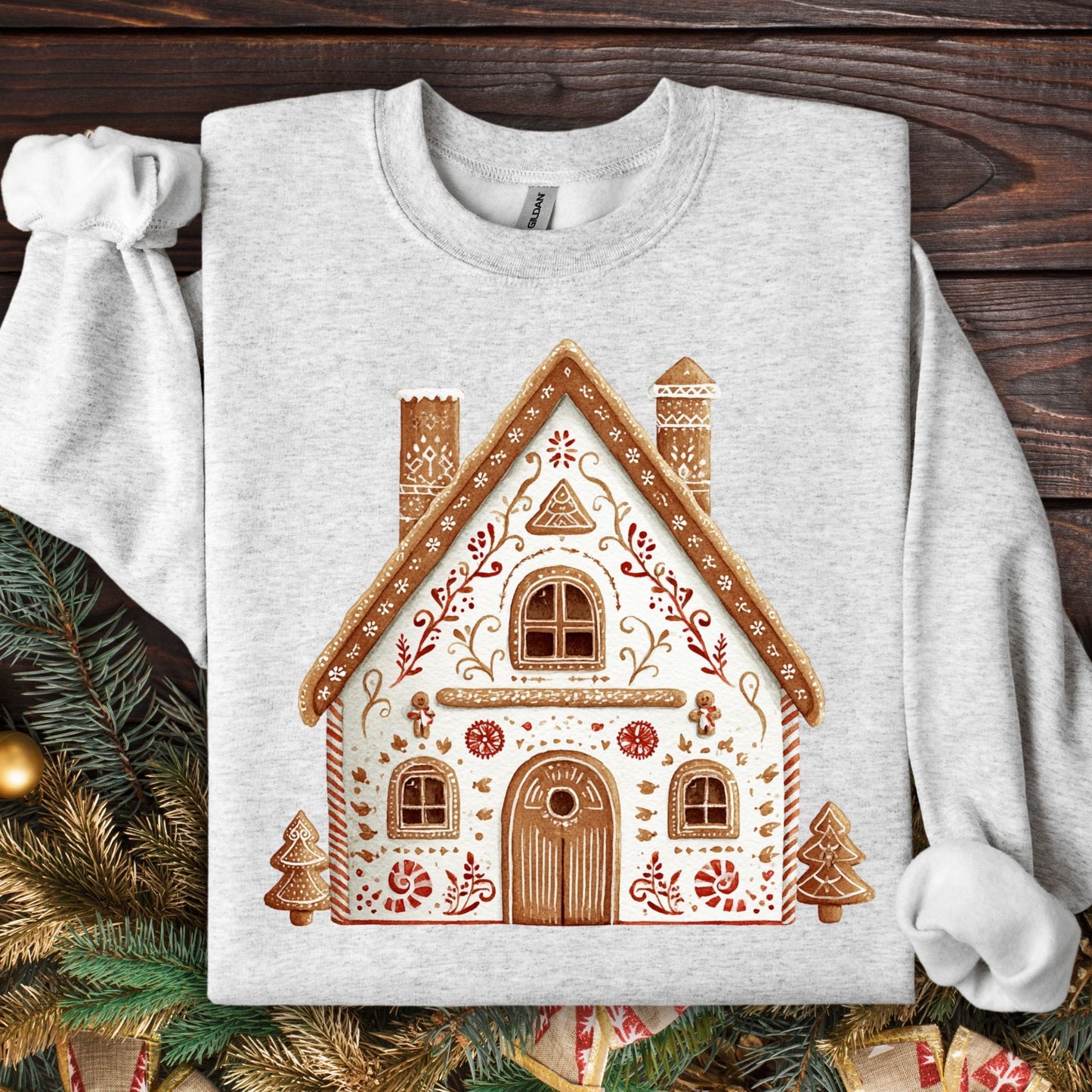 Ash Gildan sweatshirt with a folk art gingerbread house design.