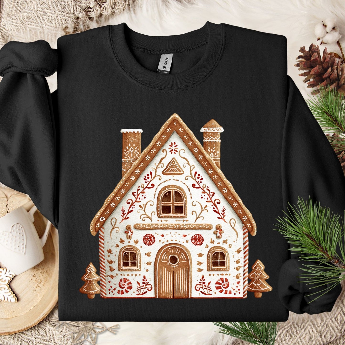 Black Gildan sweatshirt with a folk art gingerbread house design.