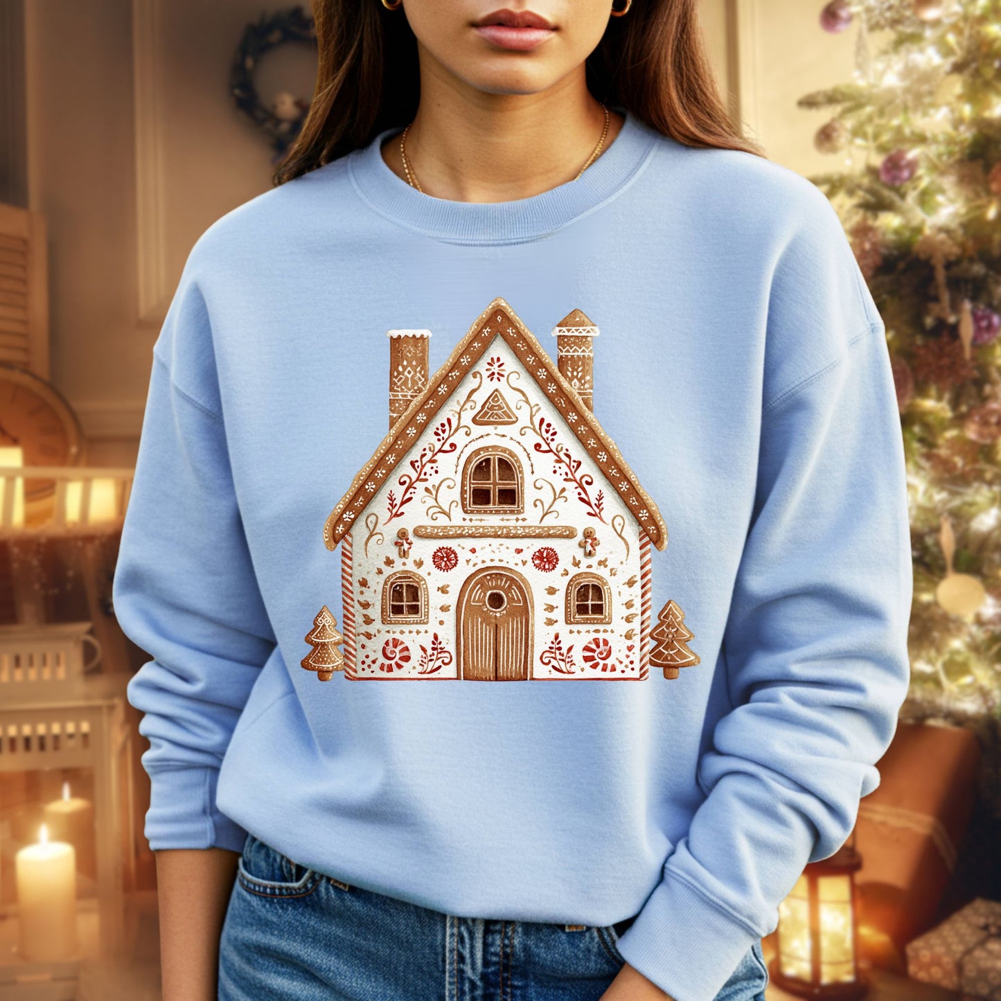 Light blue Gildan sweatshirt with a folk art gingerbread house design, featuring delicate details and soft watercolor tones.