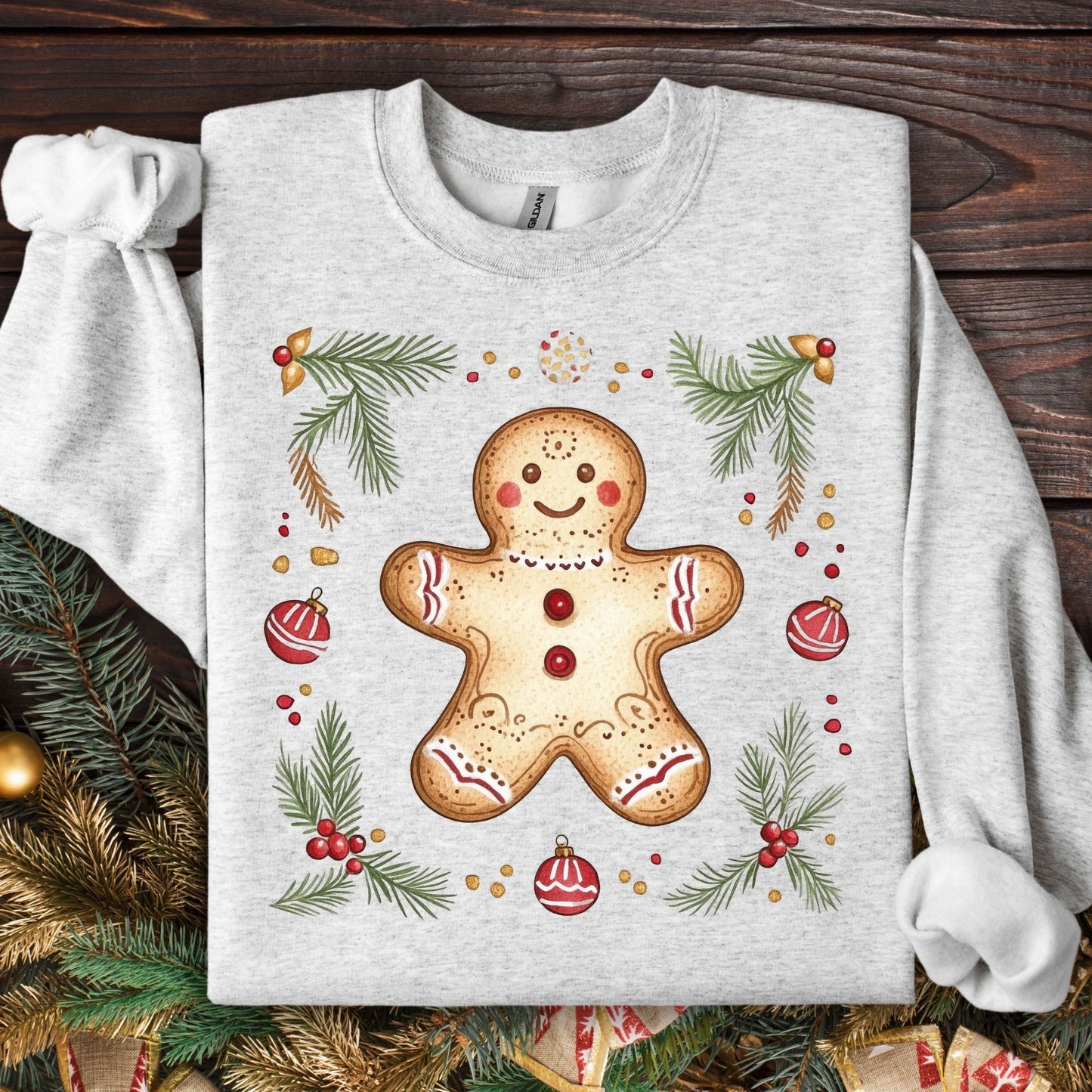 Ash Gildan sweatshirt with folk art gingerbread man, holly, and evergreen design.