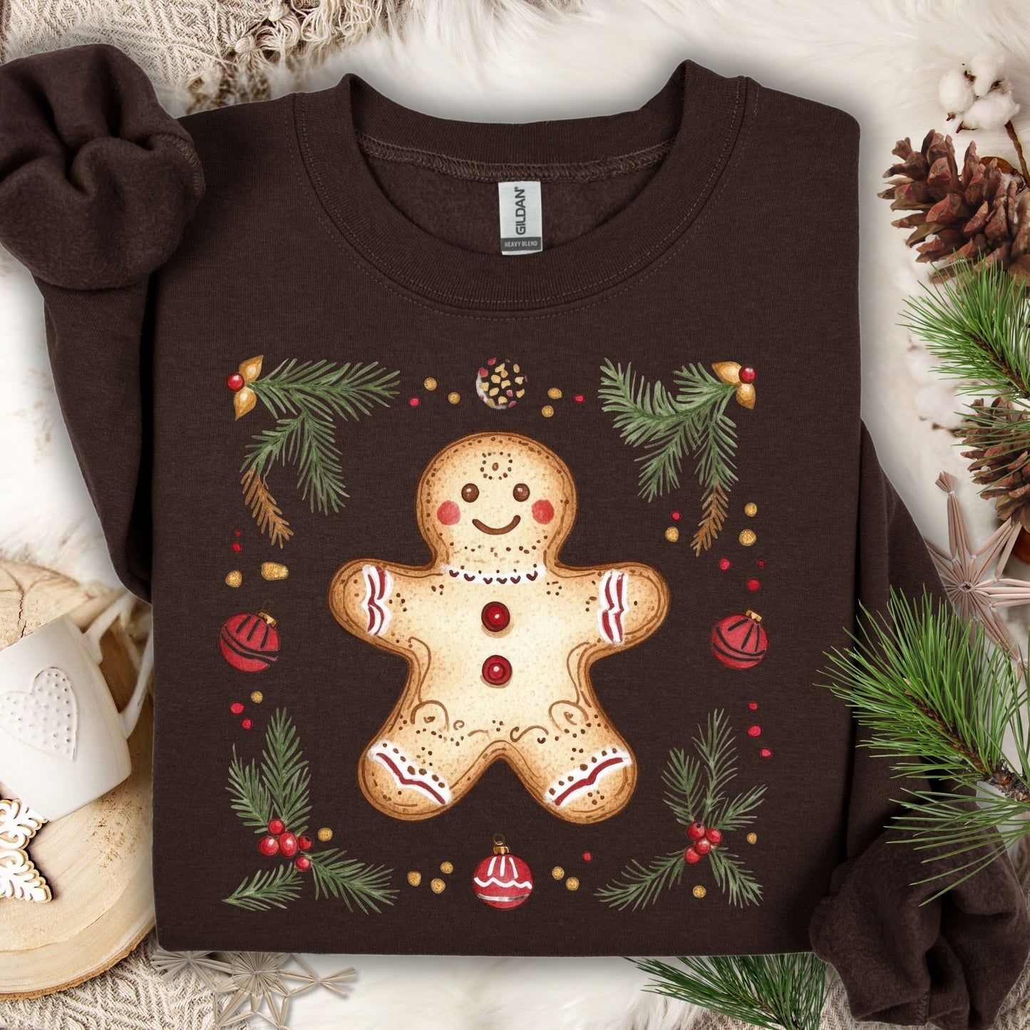 Dark Chocolate Gildan sweatshirt with a folk-art gingerbread man, holly berries, and evergreen flourishes.