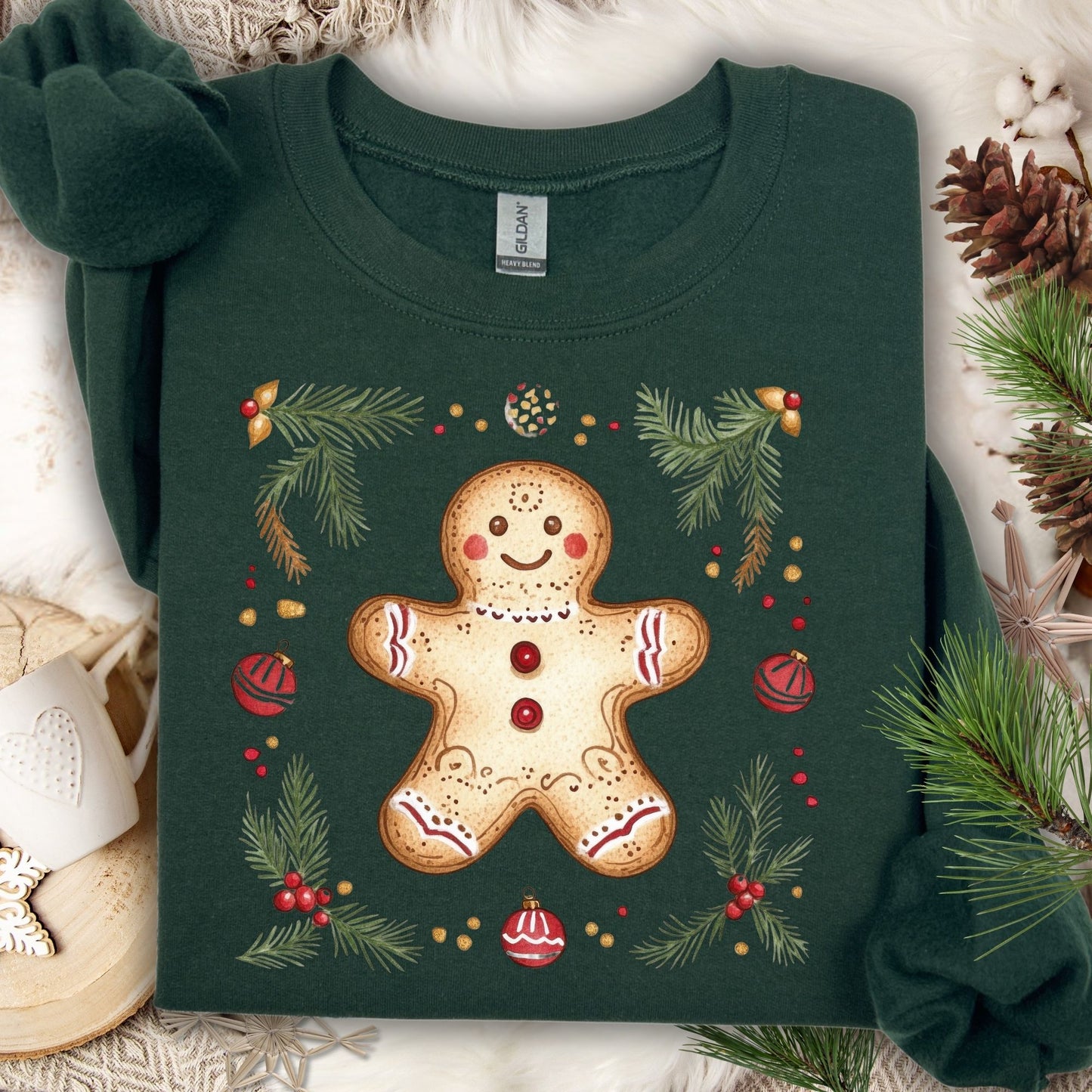 Forest Green Gildan sweatshirt with a folk art gingerbread man, holly, and evergreen design.