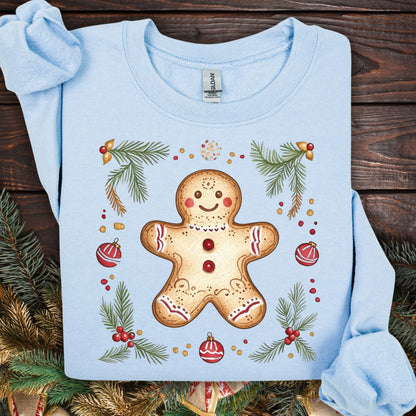 Light blue Gildan sweatshirt with a folk art gingerbread man, holly, and evergreen design.
