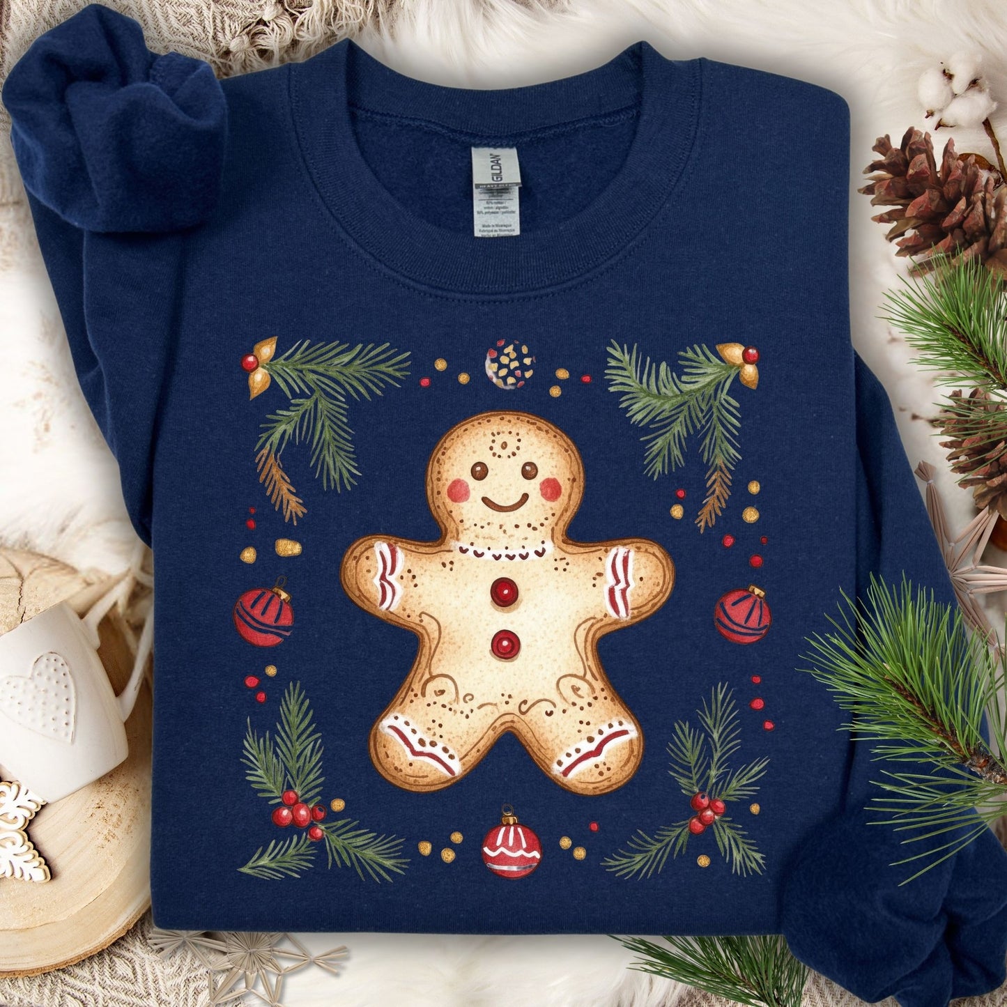 Navy Gildan sweatshirt with folk art gingerbread man, holly, and evergreen design.