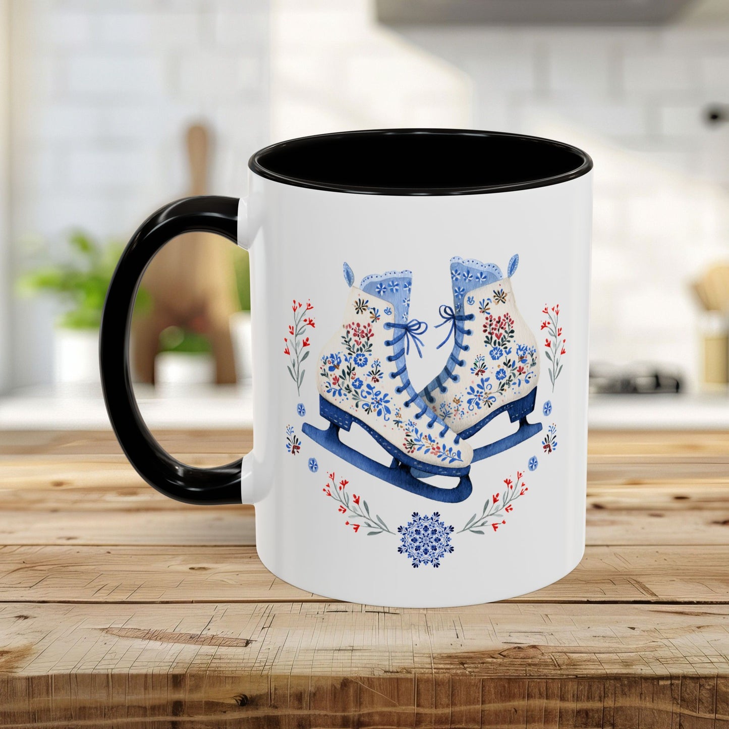 White ceramic mug with black handle and interior, featuring folk art ice skates, snowflakes, and winter berries.