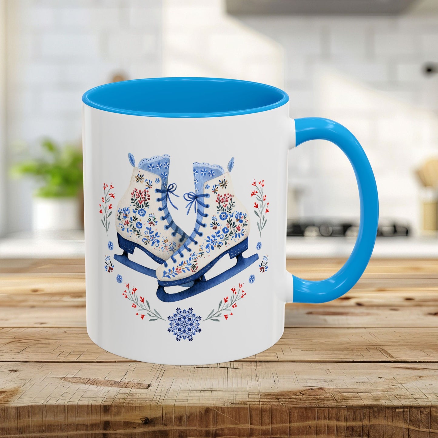 11oz ceramic mug with light blue interior/handle and folk art ice skates, snowflakes, and berries design.