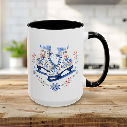 15oz white ceramic mug with black handle and interior, featuring folk art ice skates, snowflakes, and berries.