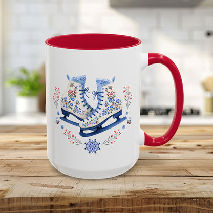 15oz white ceramic mug with red interior and handle, featuring folk art ice skates, snowflakes, and winter berries.