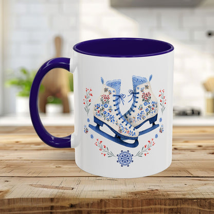 White ceramic mug with purple interior and handle, featuring folk art ice skates, snowflakes, and winter berries.