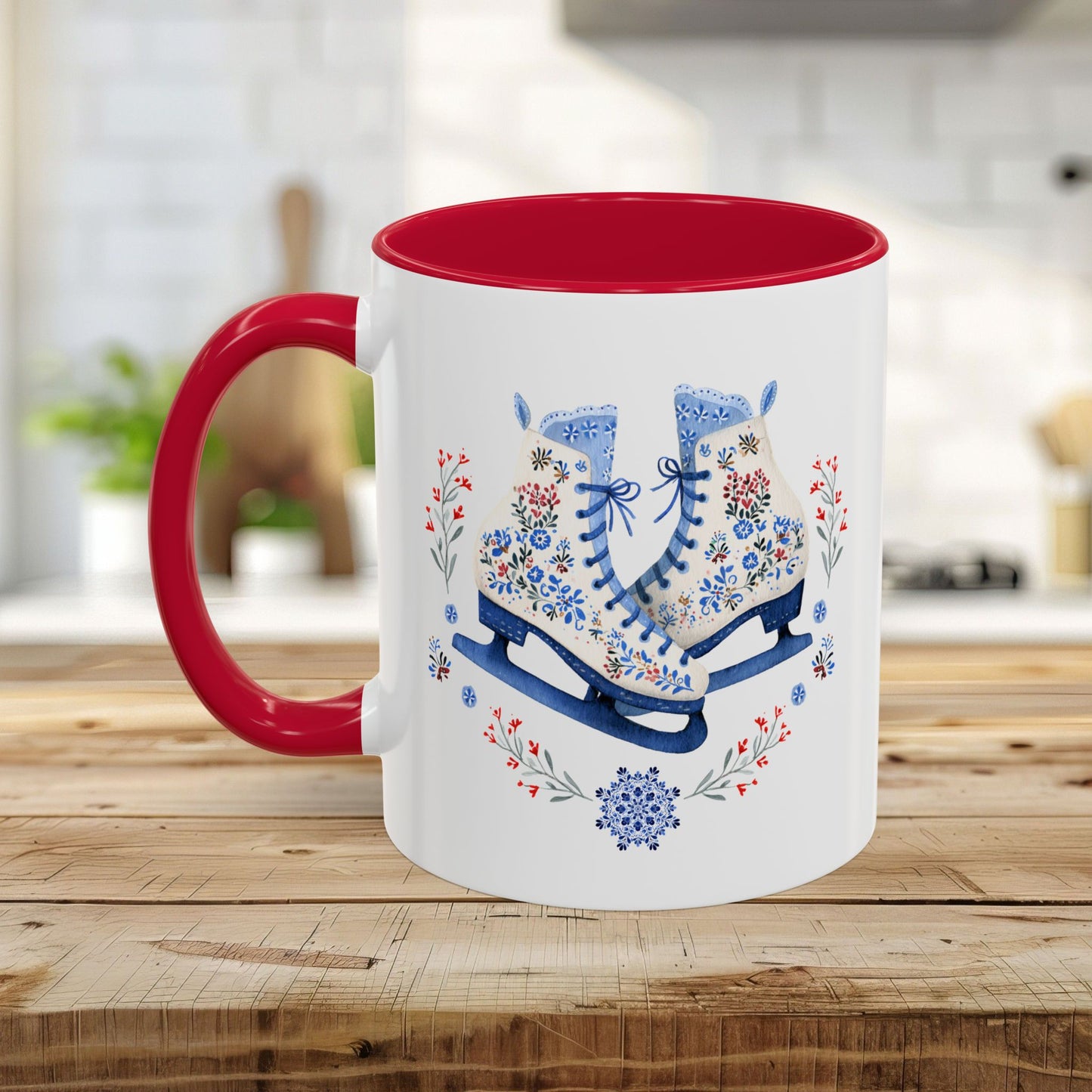 White ceramic mug with red handle and interior, featuring folk art ice skates, snowflakes, and winter berries.