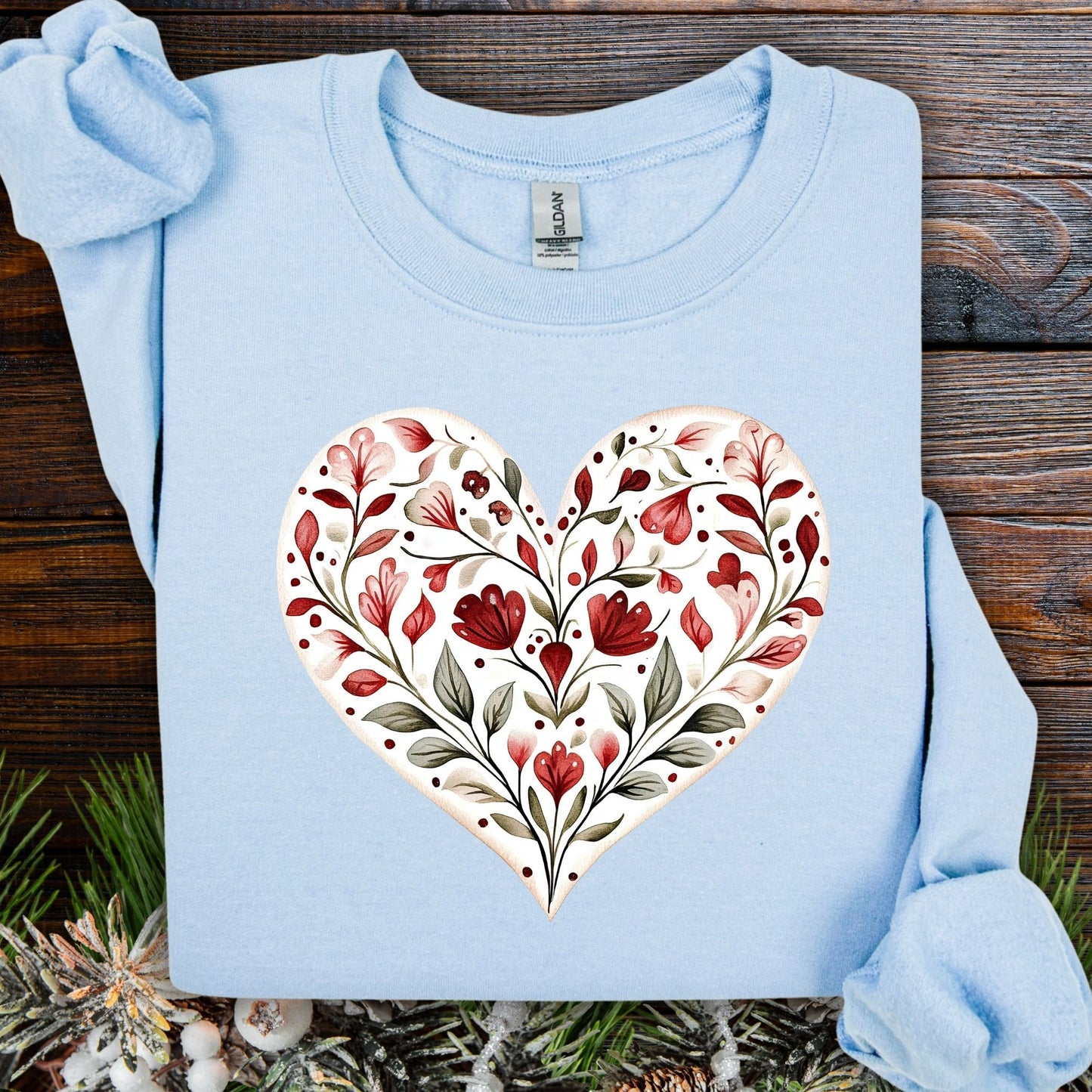 Light blue S sweatshirt with a folk art red floral heart design, 50% cotton/50% polyester blend.