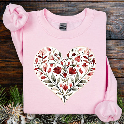 Light pink Gildan heavy blend sweatshirt with a red floral folk art heart design.