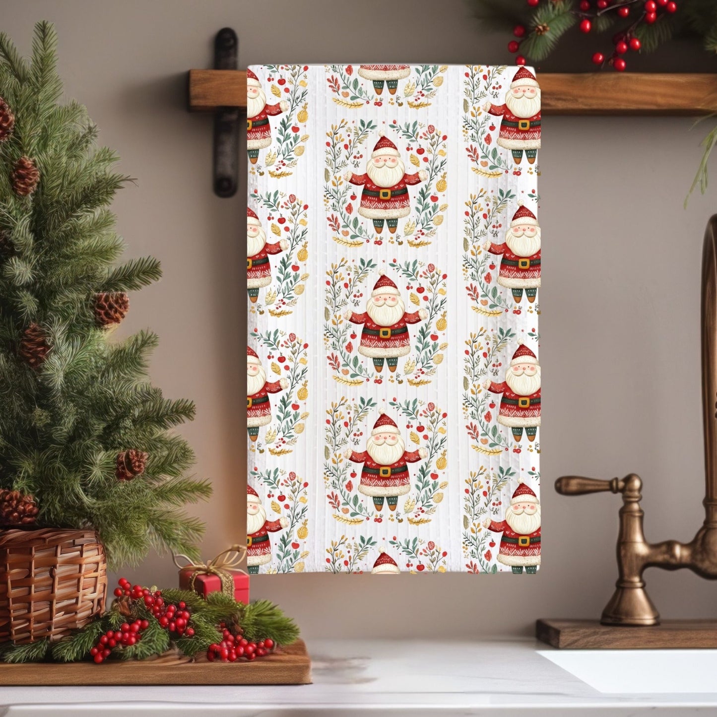 White microfiber tea towel with a folk art Santa and Christmas floral pattern, 16" x 25".