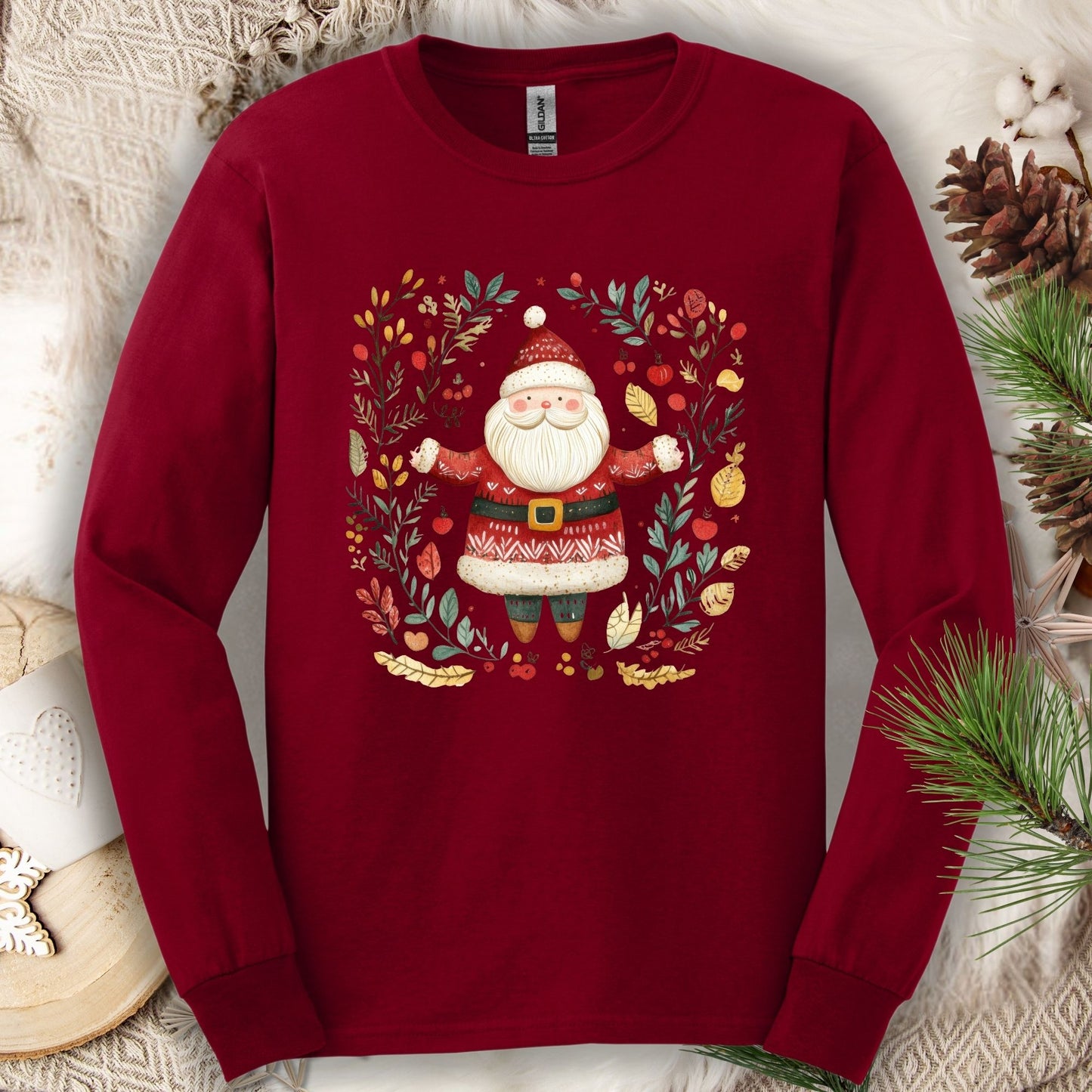 Cardinal Red Gildan long sleeve tee with a folk art Santa in a festive wreath.