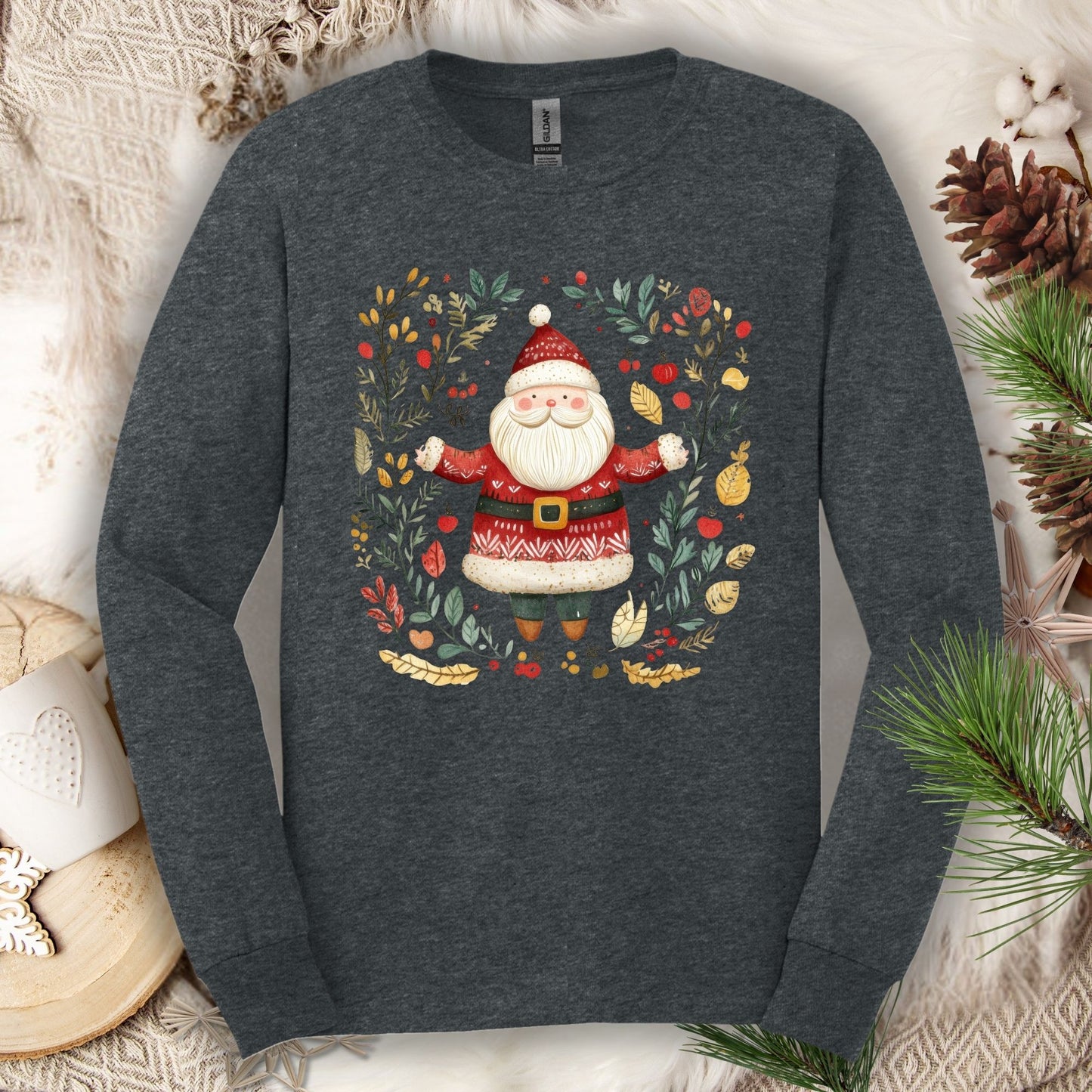 Dark heather Gildan long sleeve tee with a folk art Santa in a festive wreath.