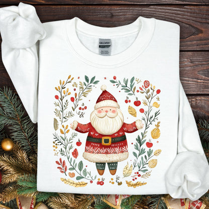 White Gildan fleece sweatshirt with a folk art Santa in a wreath of evergreens, holly, and golden accents.