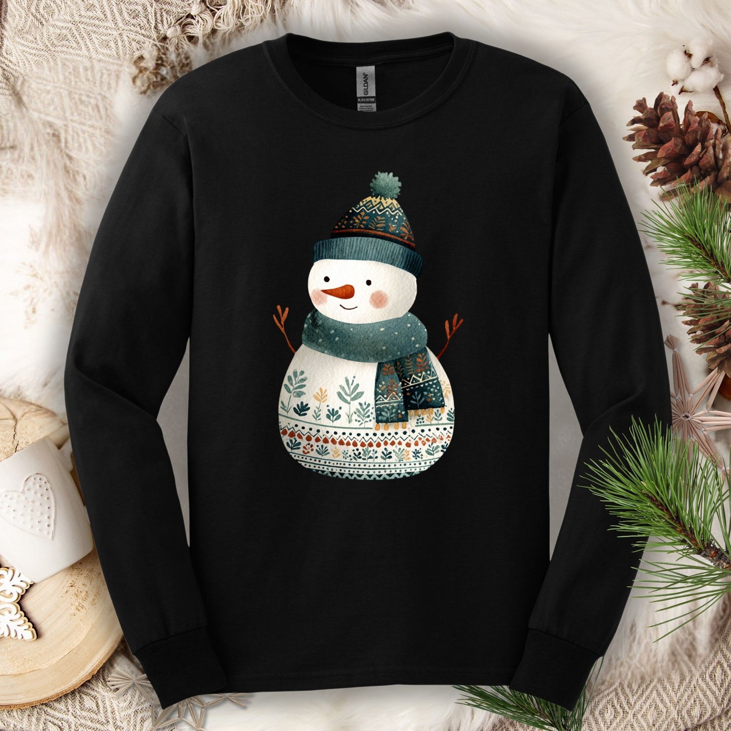Black Gildan long sleeve tee with a folk art snowman in a teal hat and scarf.