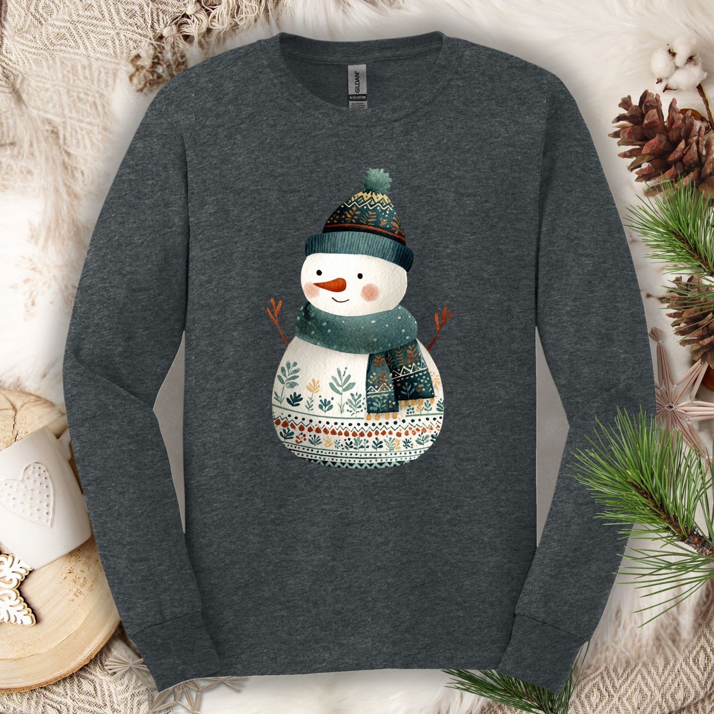 Dark Heather Gildan long sleeve tee with a folk art snowman in a teal hat and scarf.