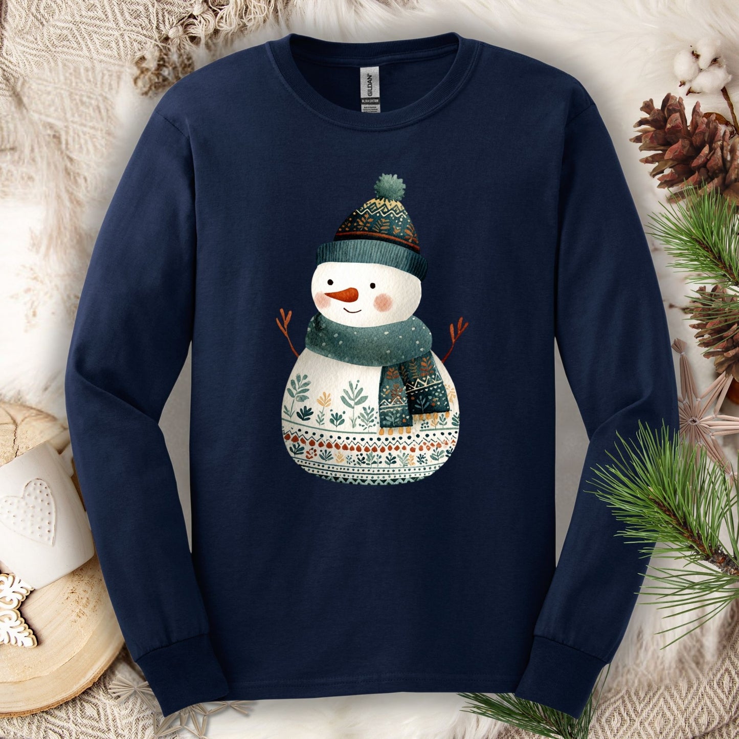Navy Gildan long sleeve tee with a folk art snowman in a teal hat and scarf.