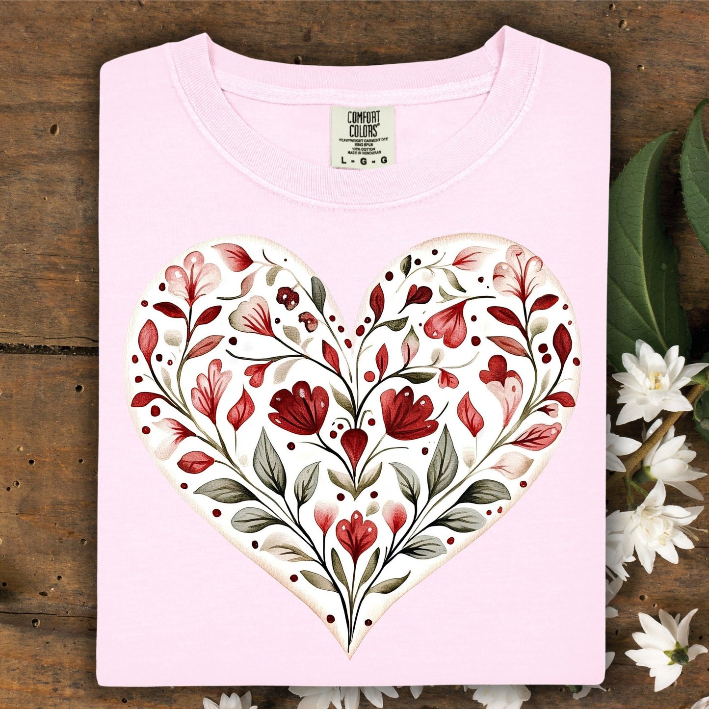 Blossom pink relaxed-fit t-shirt with a painterly folk art red floral heart design.