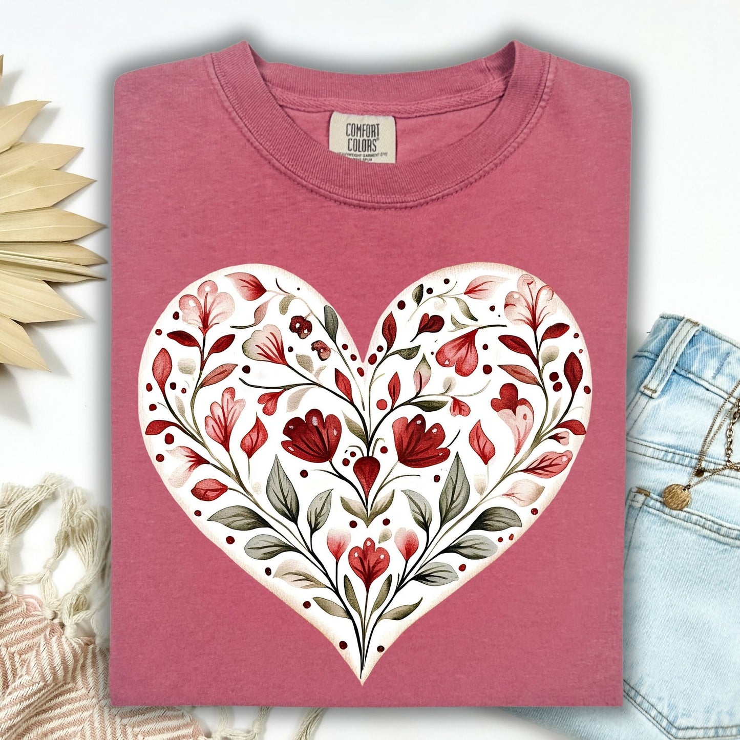 Brick S relaxed-fit t-shirt with a hand-painted folk art floral heart in red and muted green.