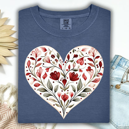 Denim blue relaxed-fit t-shirt with a large folk art floral heart design in reds and greens.