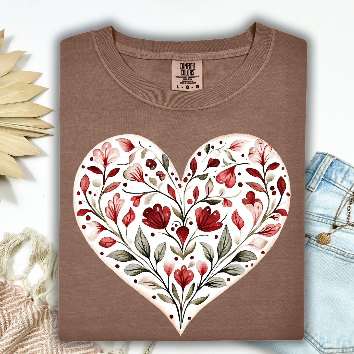 Espresso S-size t-shirt with a folk art red floral heart design, made from soft, garment-dyed cotton.