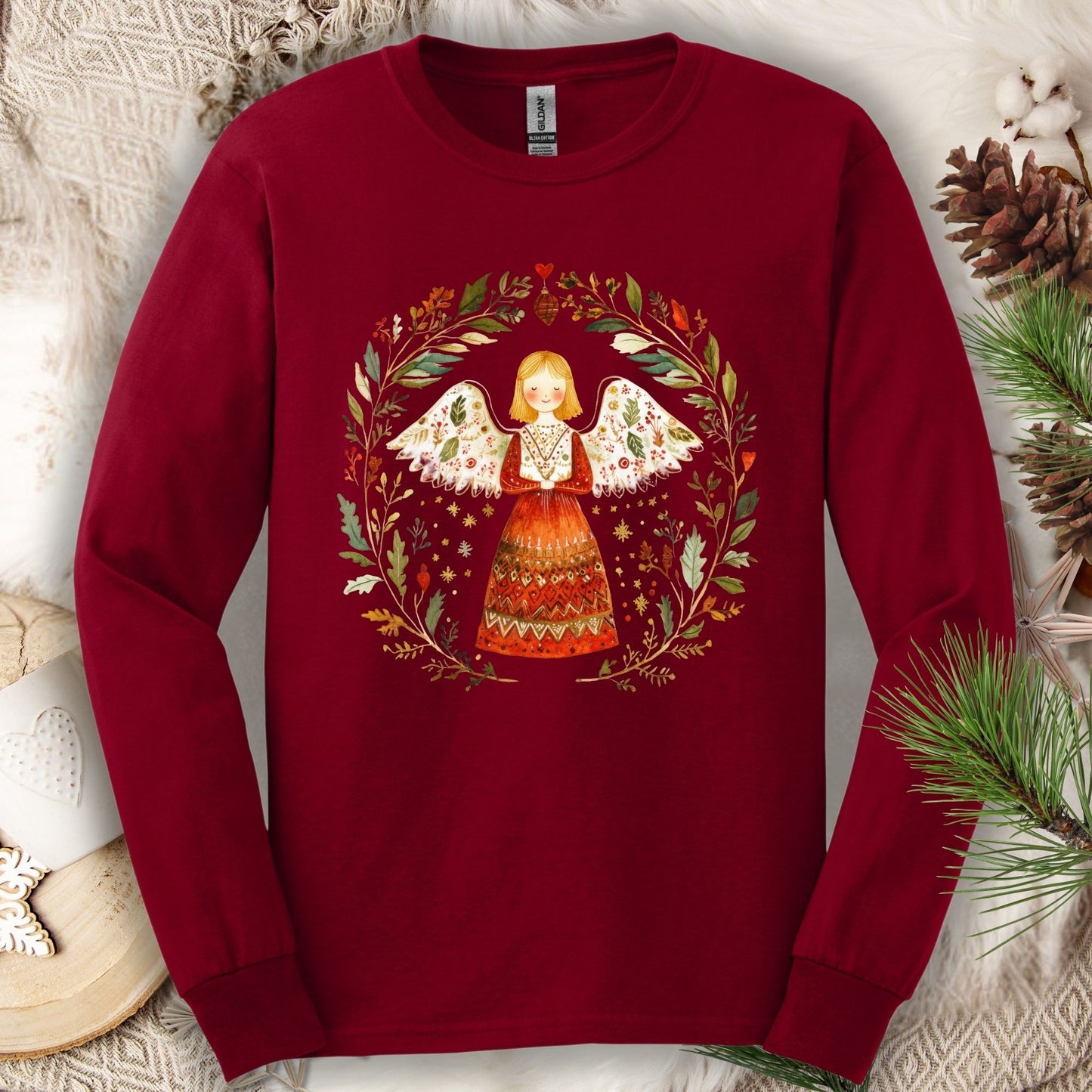 Cardinal Red Gildan Softstyle long sleeve tee with a folk art winter angel in a wreath design.