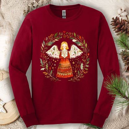 Cardinal Red Gildan Softstyle long sleeve tee with a folk art winter angel in a wreath design.