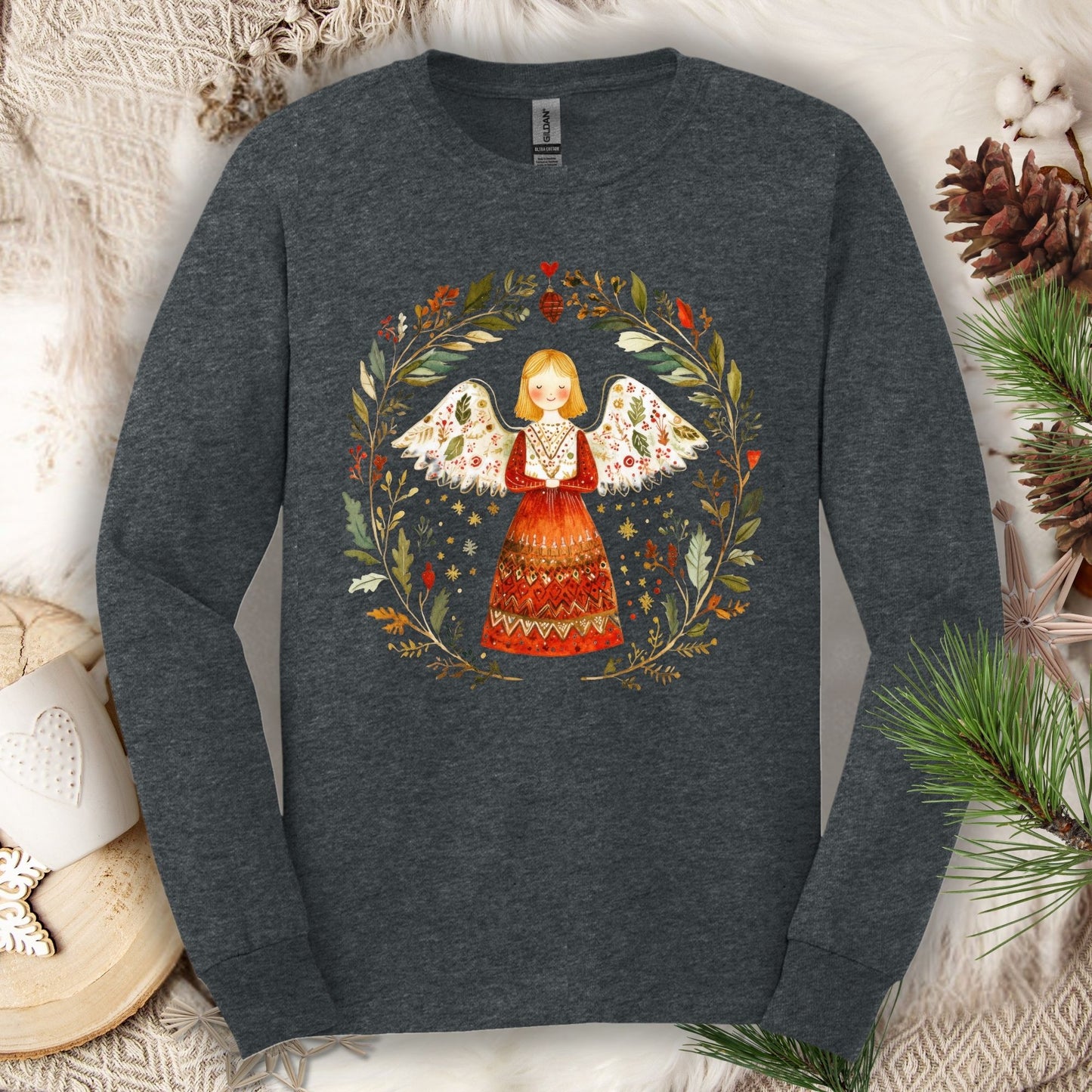 Dark Heather Gildan Softstyle long sleeve tee with a folk art winter angel in a wreath.