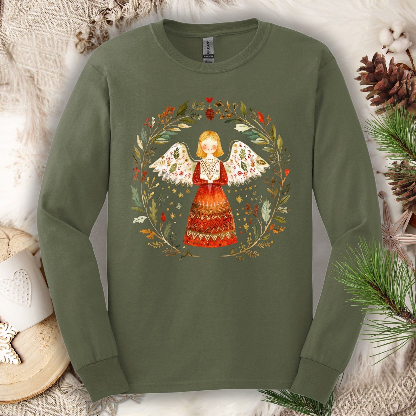 Military Green Gildan Softstyle long sleeve tee with a folk art winter angel in a wreath design.
