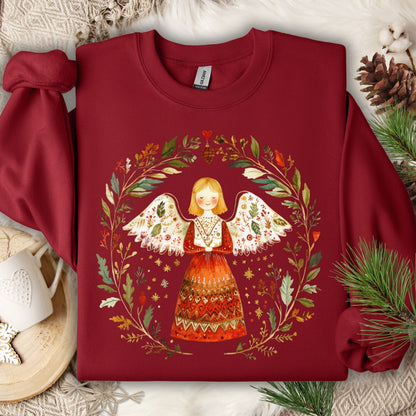 Cardinal Red fleece sweatshirt with a folk art angel in a winter wreath design.