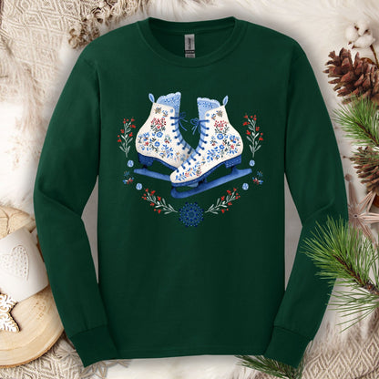 Forest Green long sleeve tee with folk art winter ice skates in blue, red, and white floral designs.