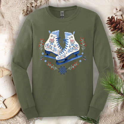 Military Green long sleeve tee with folk art winter ice skates in blues, reds, and whites, surrounded by florals.