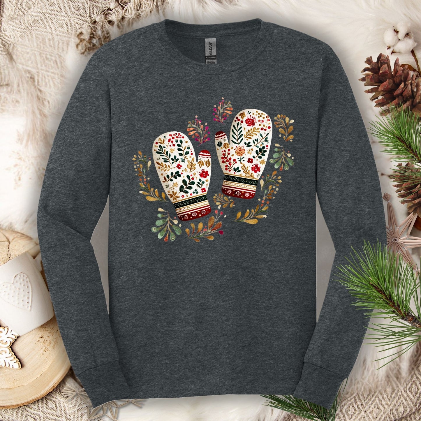 Dark heather long sleeve tee with watercolor folk art mittens in red, cream, evergreen, and gold.