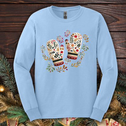 Light blue long sleeve tee with watercolor folk art mittens in red, cream, evergreen, and gold.