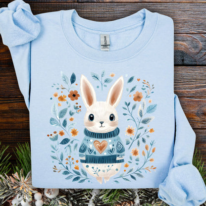 Light blue Folk Art Winter Rabbit sweatshirt with a cute bunny in a knitted sweater and floral frame.
