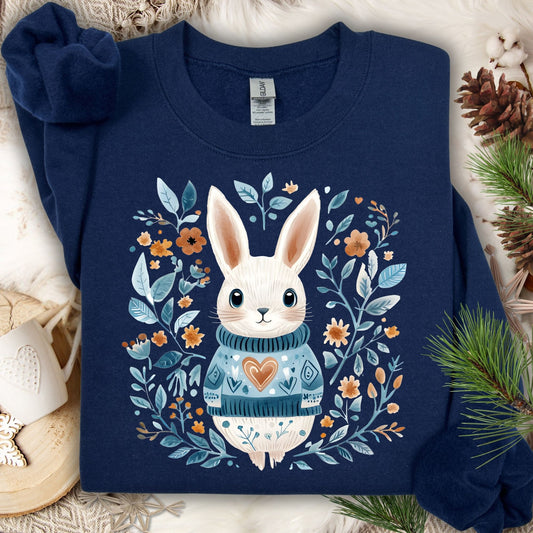 Navy Folk Art Winter Rabbit sweatshirt with a white bunny in a blue sweater, surrounded by floral designs.