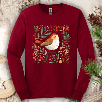 Cardinal Red Gildan long sleeve tee with folk art winter sparrow, evergreens, holly, and ornaments.
