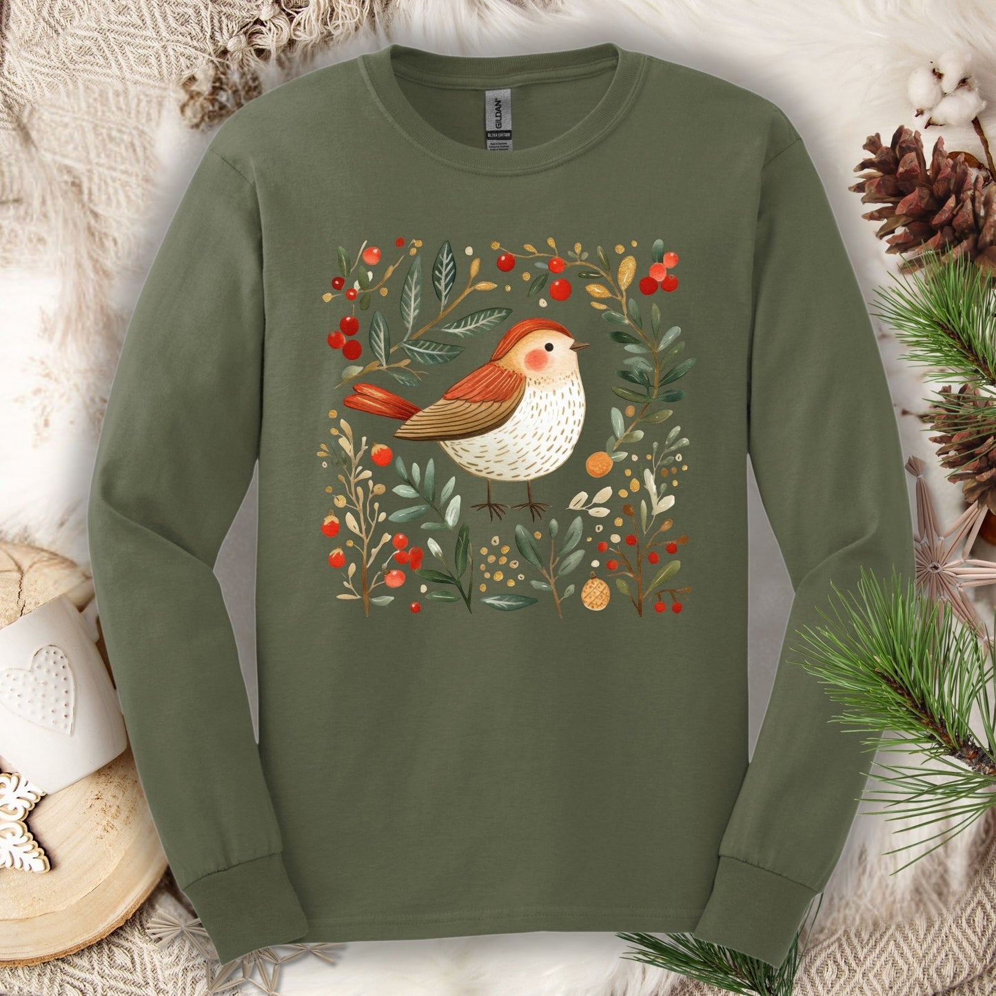 Military Green Gildan Softstyle long sleeve tee with folk art winter sparrow, evergreens, holly, and ornaments.