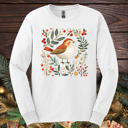 White Gildan Softstyle long sleeve tee with folk art winter sparrow, evergreens, holly, and ornaments.