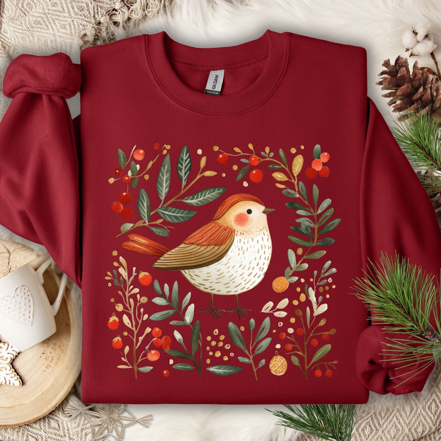 Cardinal Red fleece sweatshirt with folk art sparrow, evergreens, holly, and Christmas ornaments.