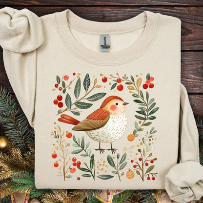 Sand fleece sweatshirt with folk art sparrow, evergreens, holly, and Christmas ornaments.