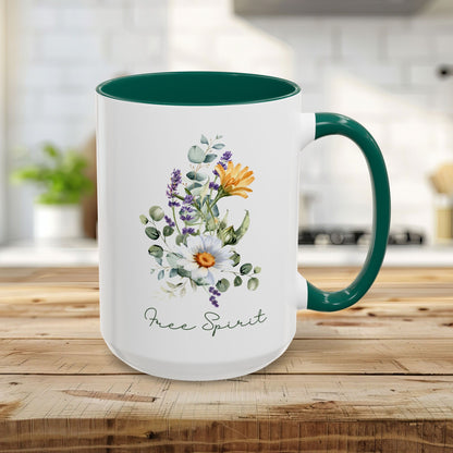 15oz white ceramic mug with green handle and interior, featuring watercolor wildflowers and "Free Spirit" script.