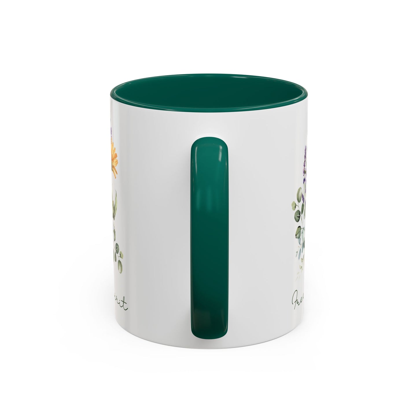 White ceramic mug with a green handle and interior, featuring watercolor wildflowers and "Free Spirit" script.