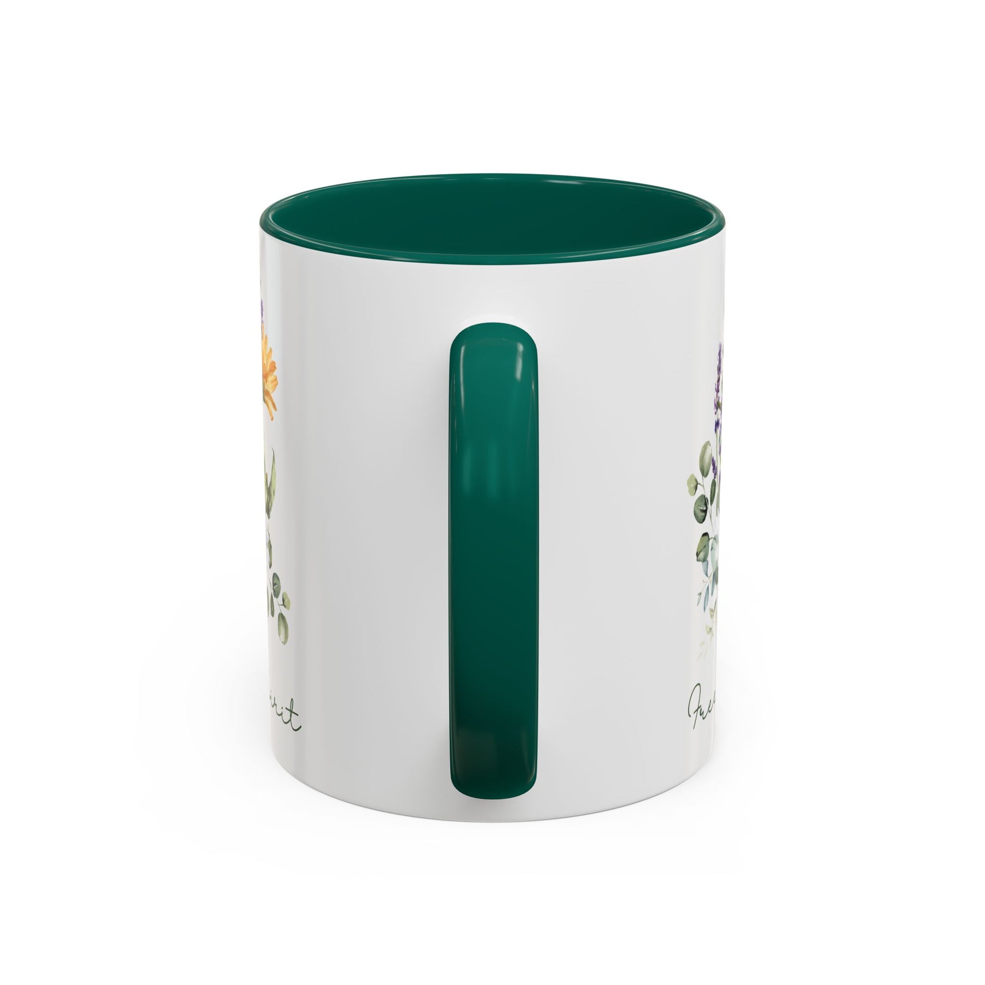 White ceramic mug with a green handle and interior, featuring watercolor wildflowers and "Free Spirit" script.