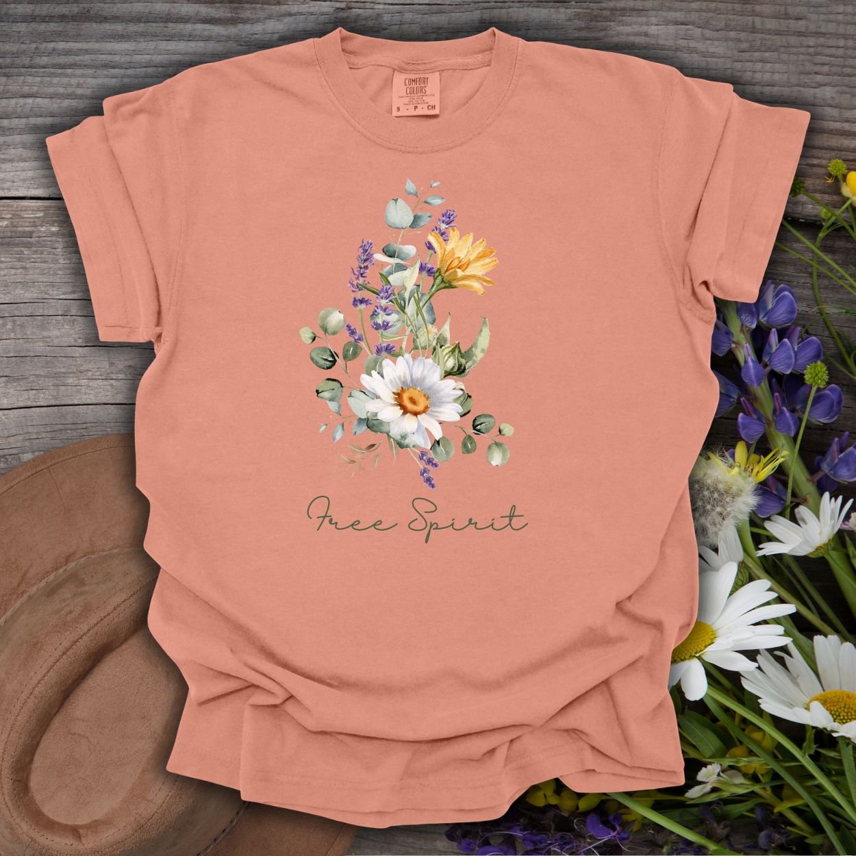 Terracotta relaxed-fit t-shirt with a hand-painted daisy, lavender, eucalyptus bouquet and "Free Spirit" script.