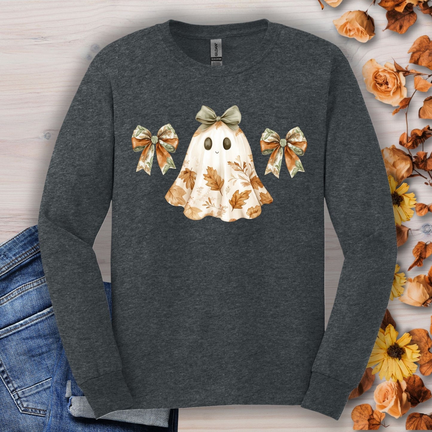 Dark heather long sleeve t-shirt with a friendly boho ghost, fall leaves, and bows.