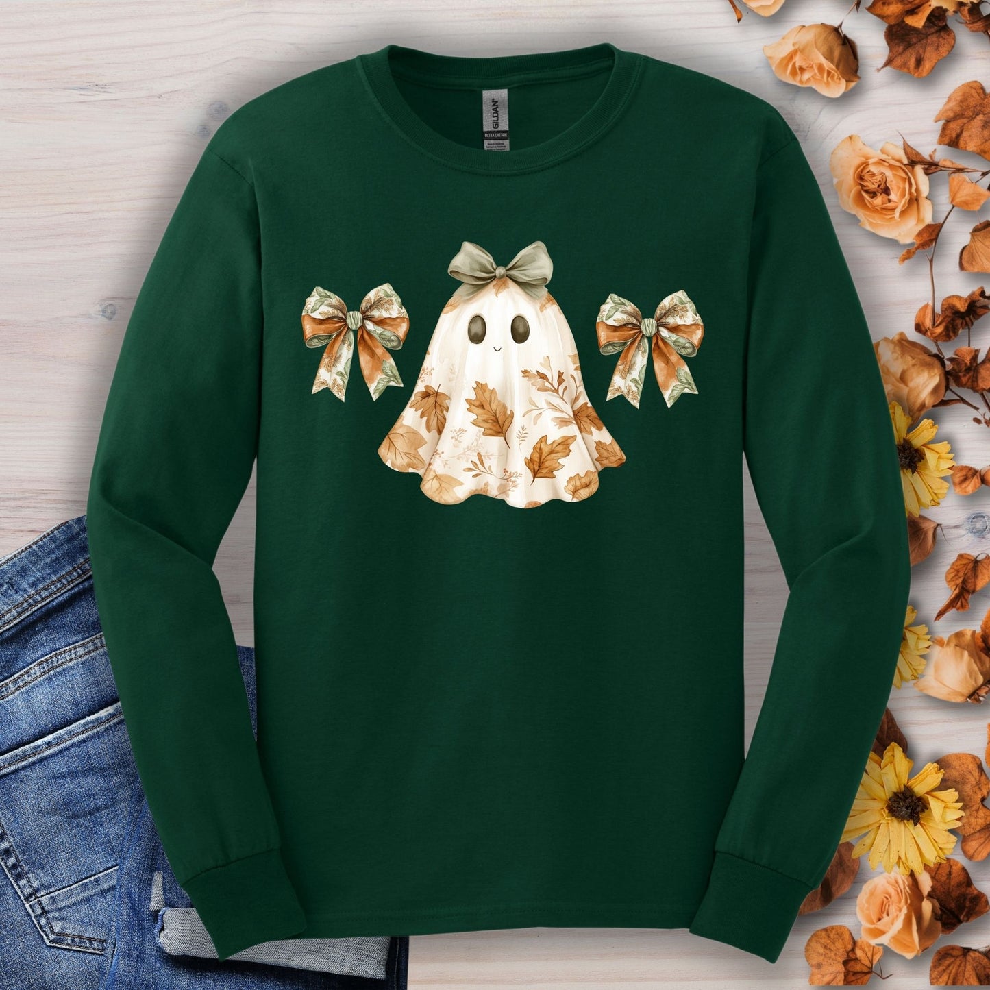 Forest green long sleeve t-shirt with a friendly ghost, fall leaves, and bows design.